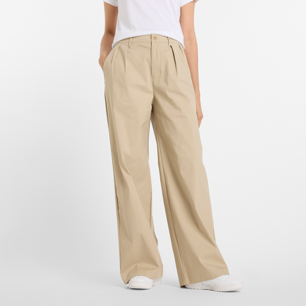 Dámské kalhoty New Balance WP51538SOT – béžové