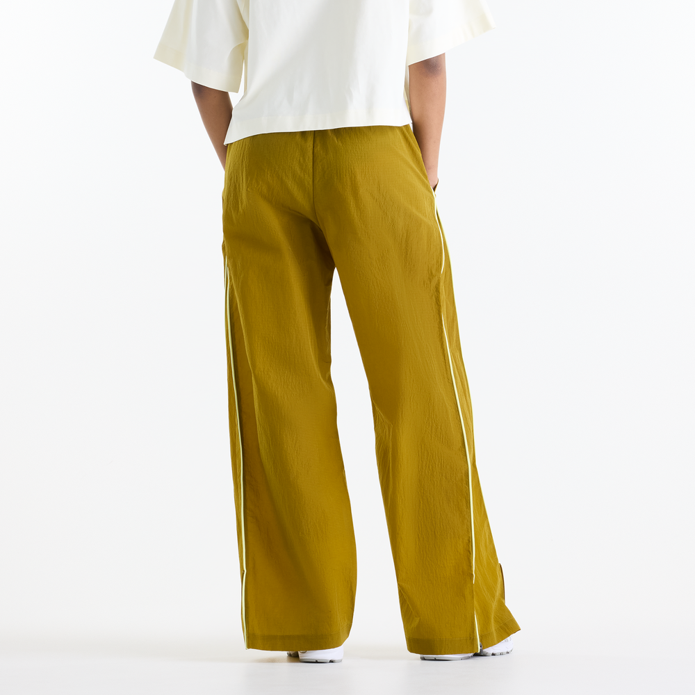 Dámské kalhoty New Balance Sport Legacy – žluté