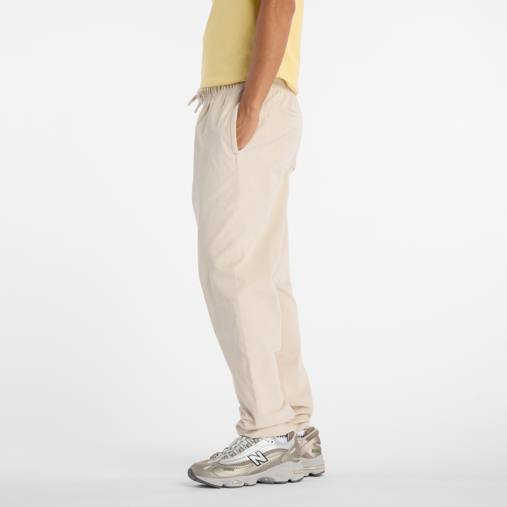 Pánské kalhoty New Balance MP53521TWF – béžové