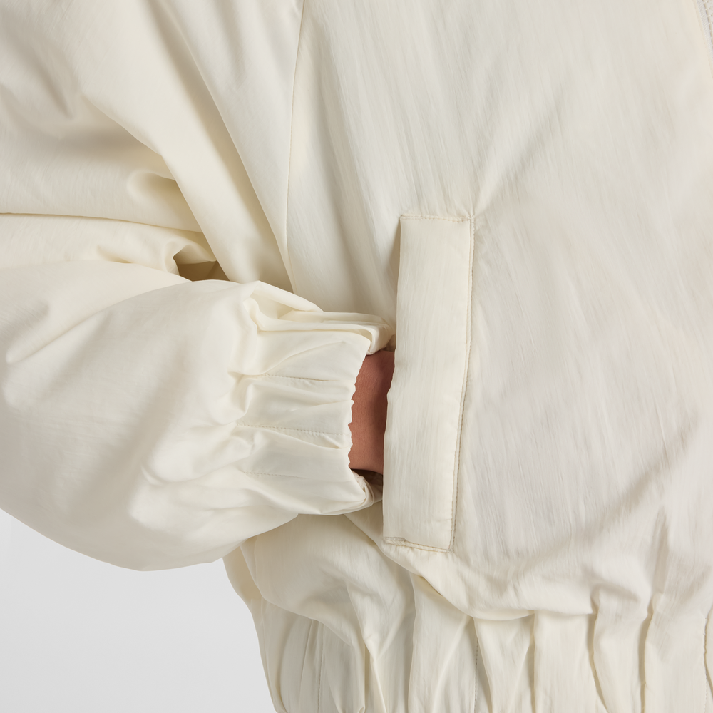 Dámská bunda New Balance WJ61D8YXSST​ – béžové