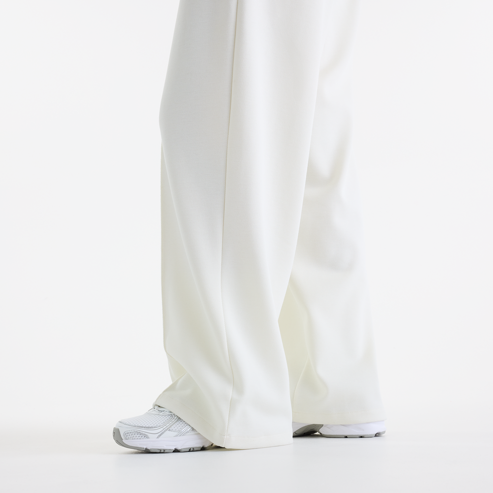 Dámské kalhoty New Balance Sport Legacy – bílé