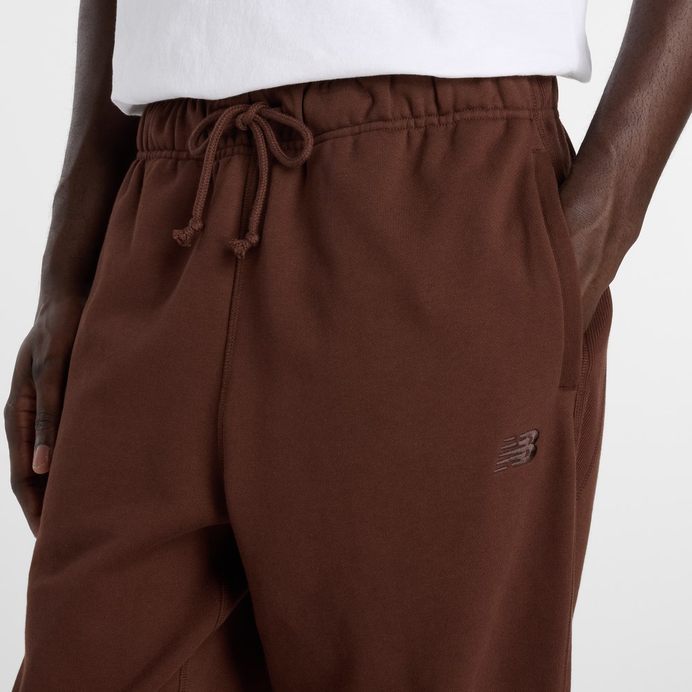 Pánské kalhoty New Balance MP41508ABJ – hnědý