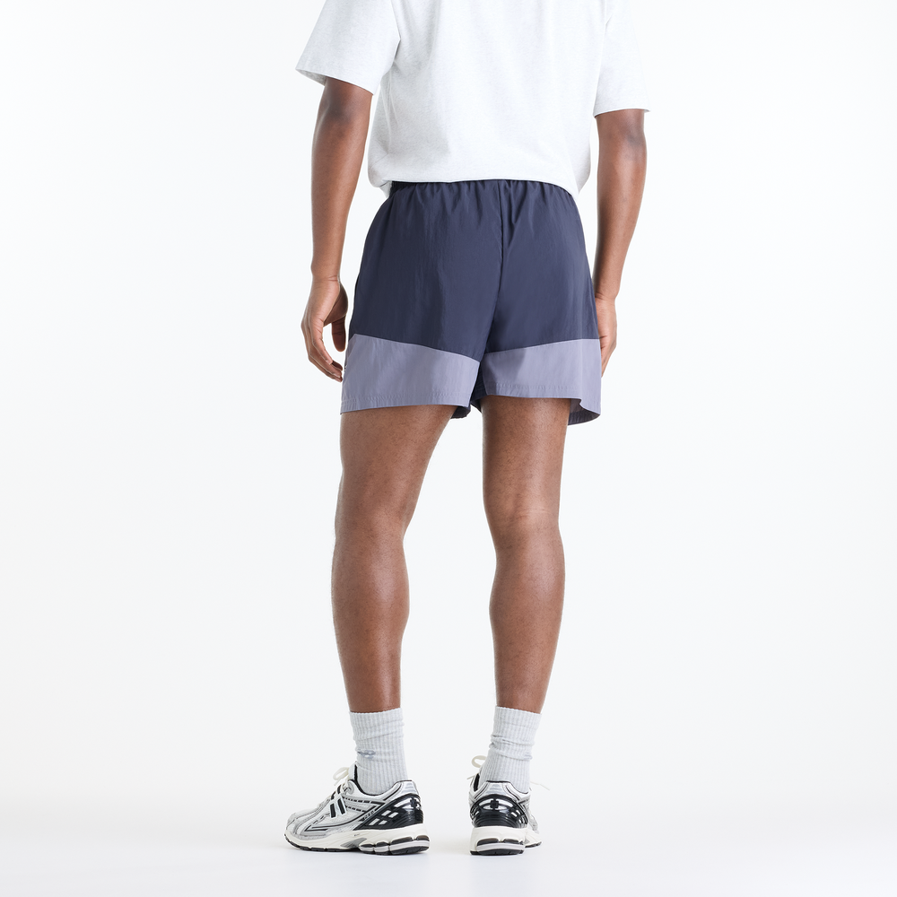 Pánské šortky New Balance Sport Legacy – fialové