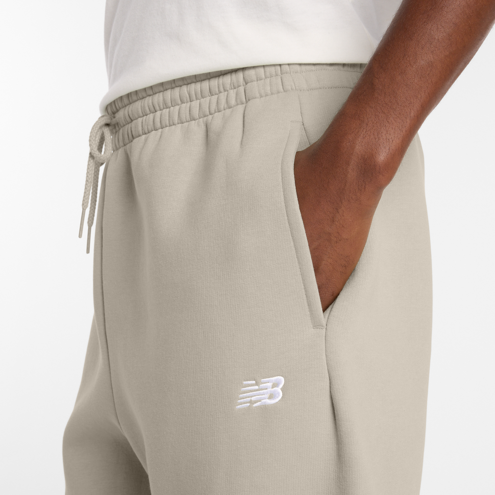Pánské kalhoty New Balance MP41503TWF – béžové
