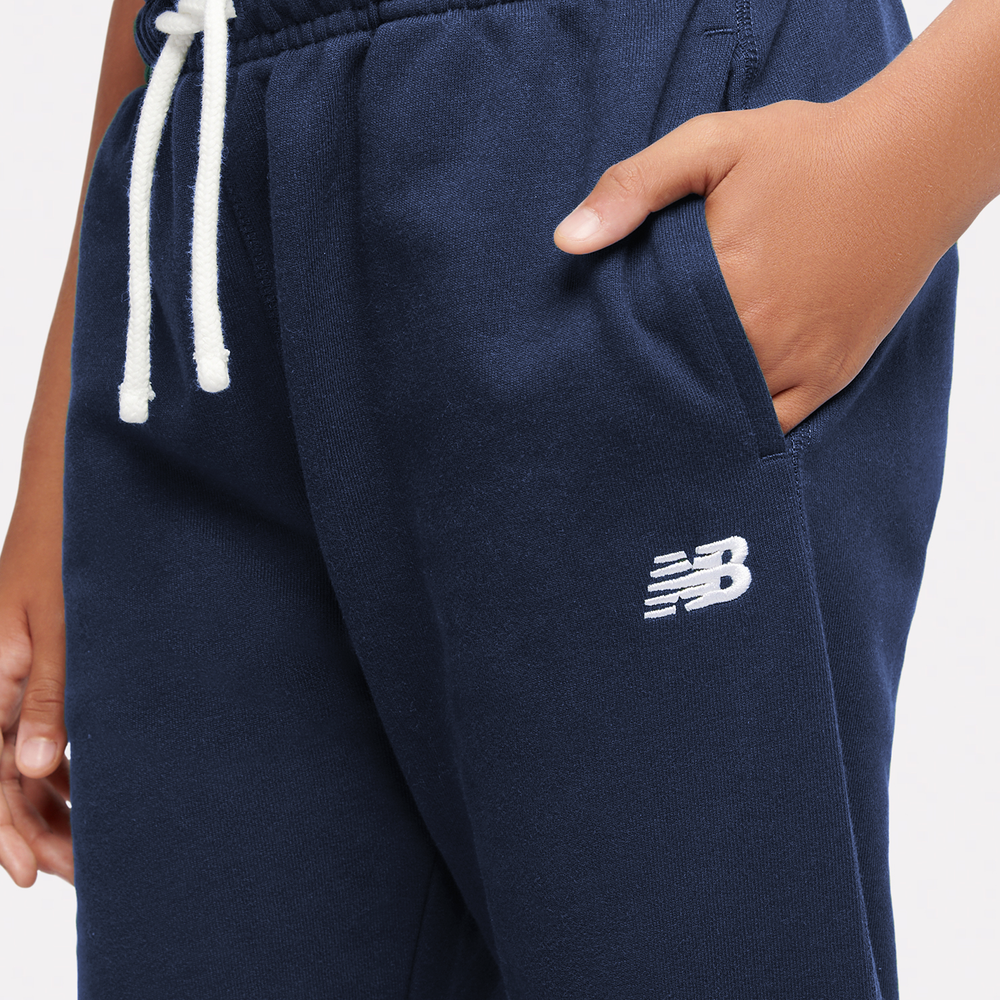 Dětské kalhoty New Balance LAKB0060NNY – tmavomodrá