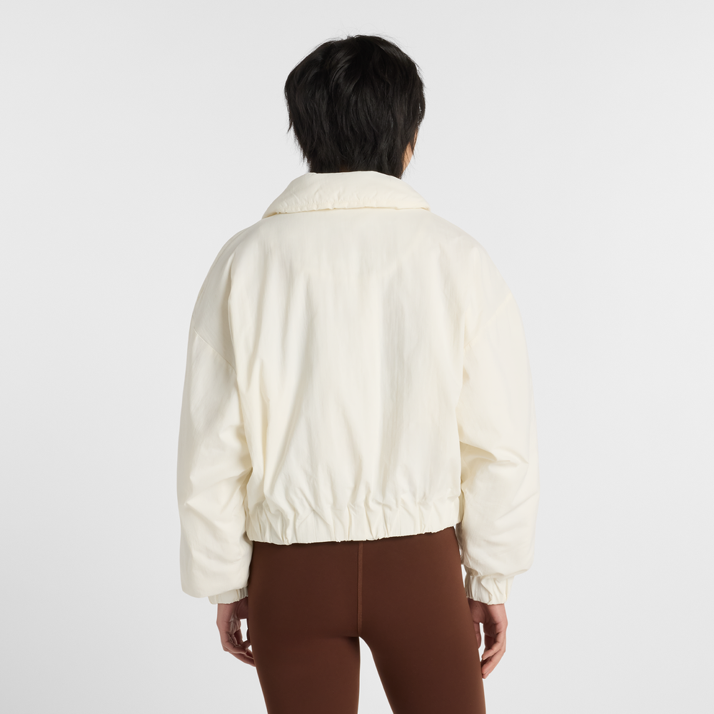 Dámská bunda New Balance WJ61D8YXSST​ – béžové