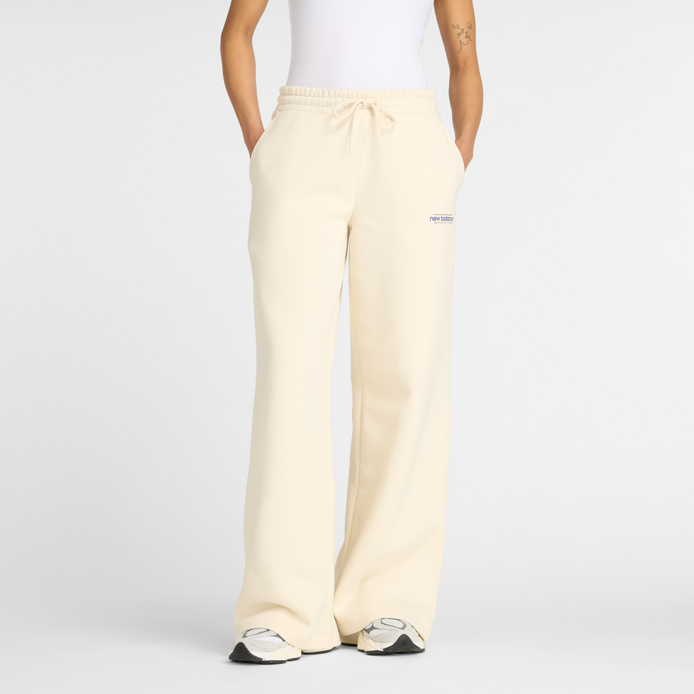 Dámské kalhoty New Balance WP53903LIN – béžové