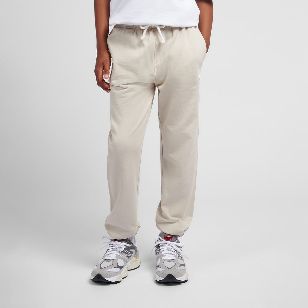 Dětské kalhoty New Balance LAKB0060TWF – béžové