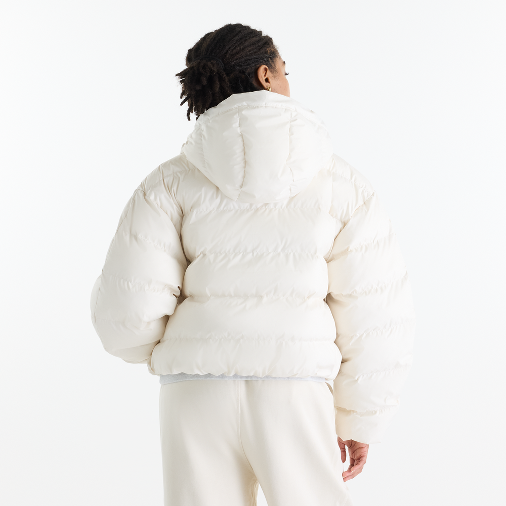 Dámská bunda New Balance Boston Puffer – béžové