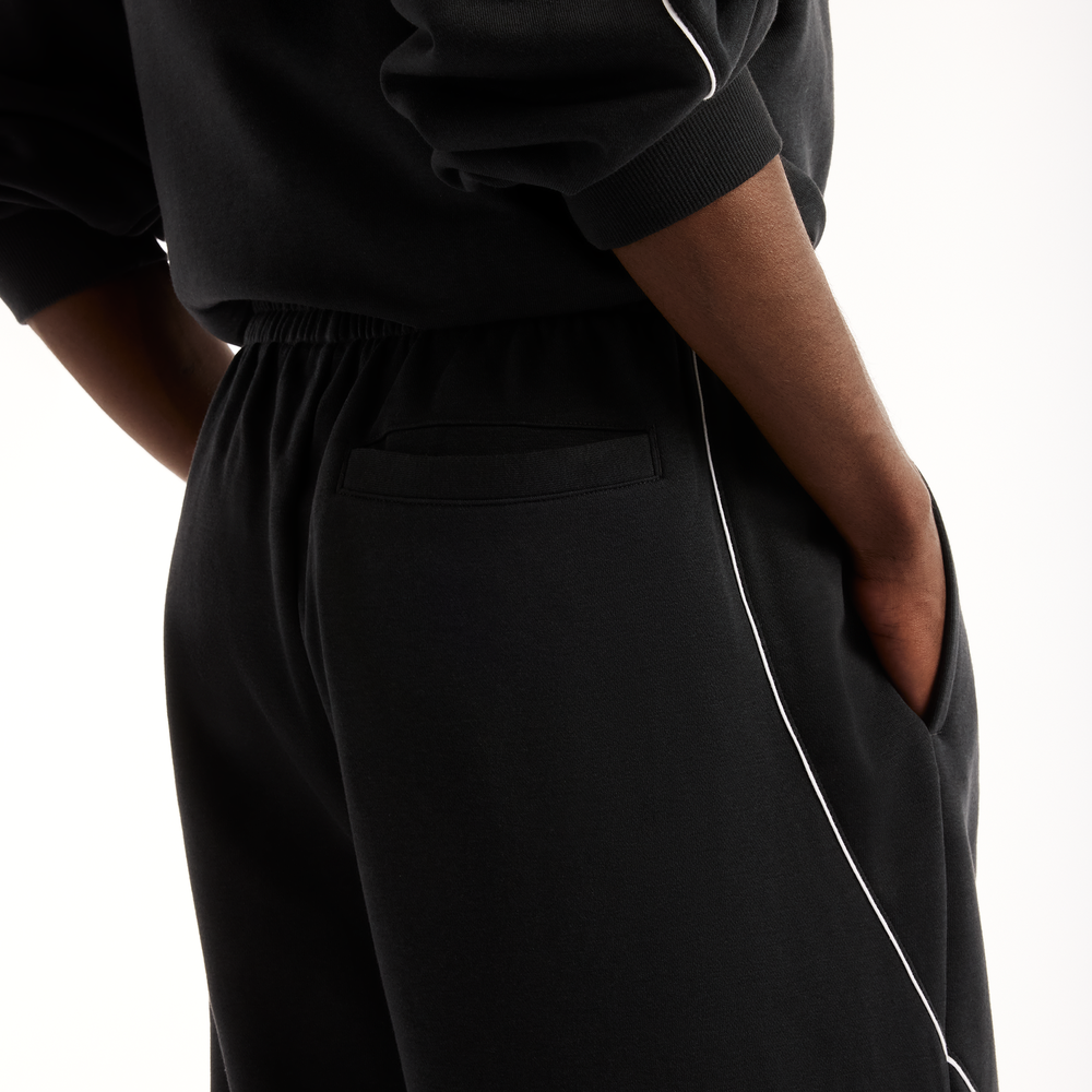 Pánské kalhoty New Balance Trackside Pants – černé