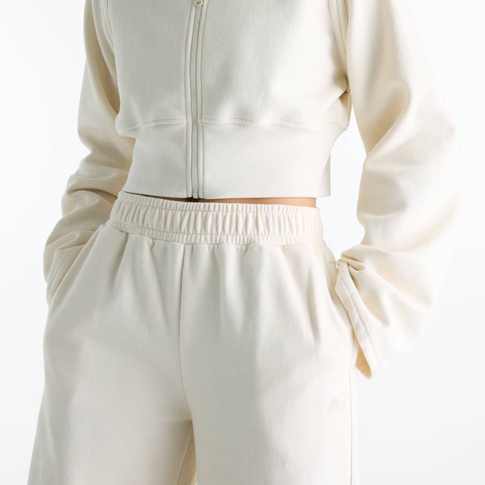 Dámské kalhoty New Balance Brushed Coastal – béžové
