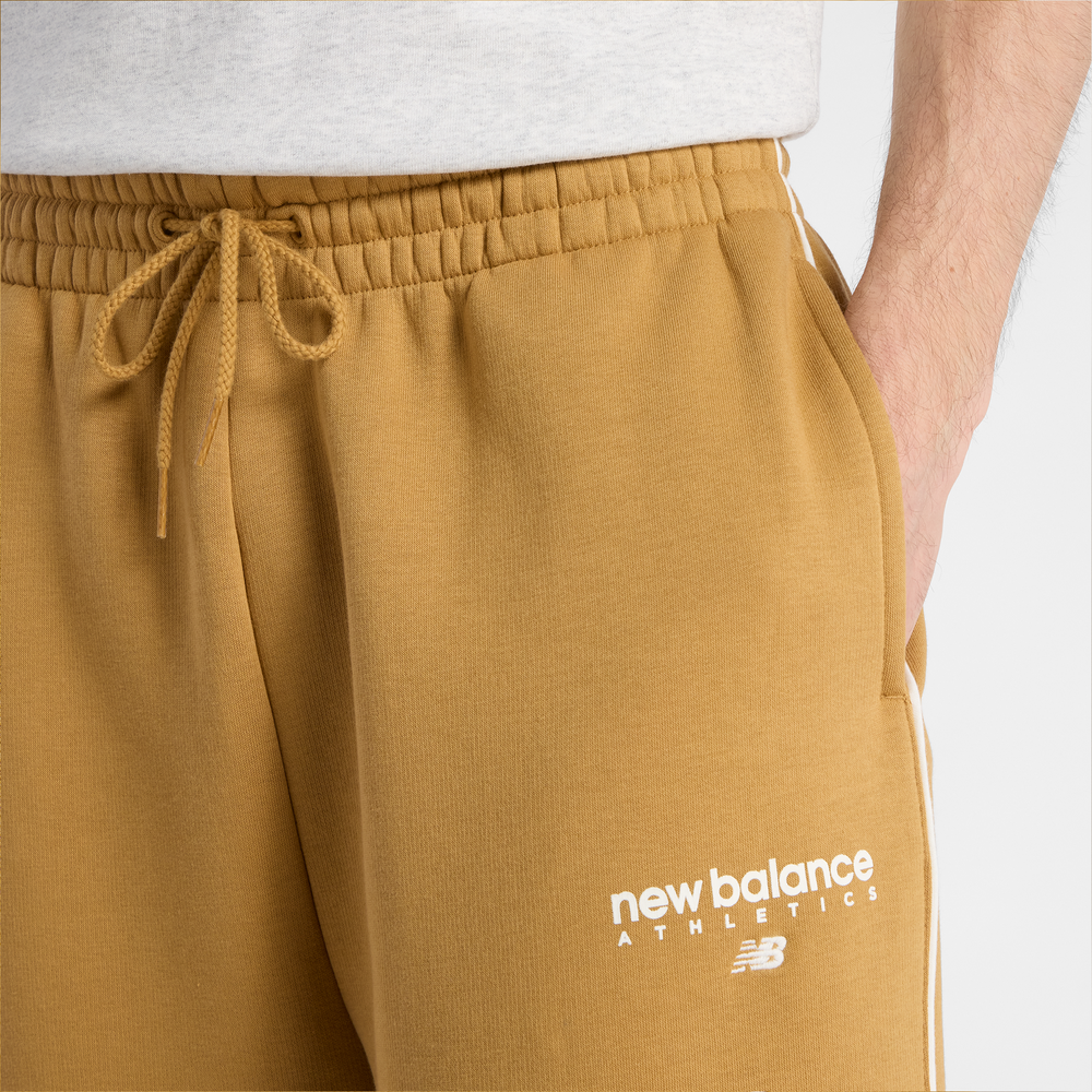Pánské kalhoty New Balance MB61M77EABG – oranžová