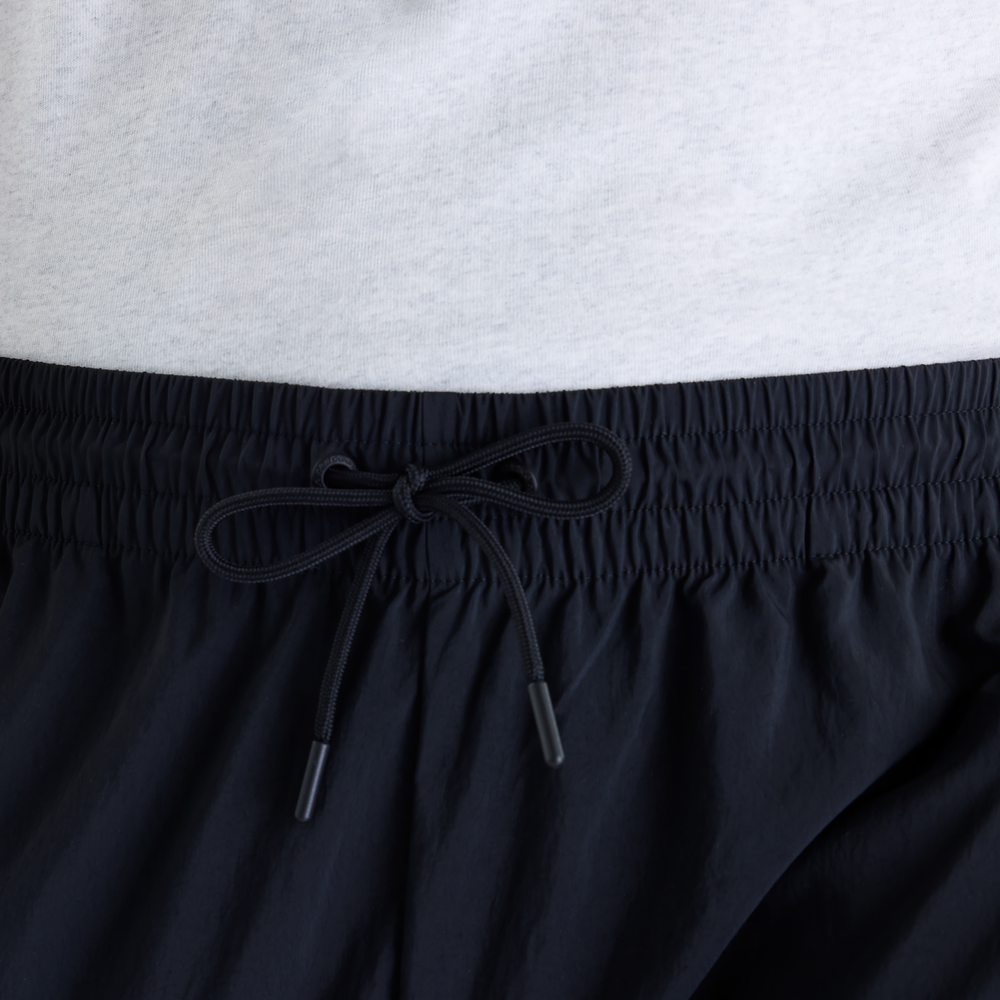Pánské kalhoty New Balance Sport Legacy – černé