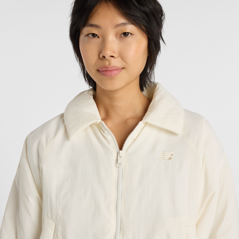 Dámská bunda New Balance WJ61D8YXSST​ – béžové