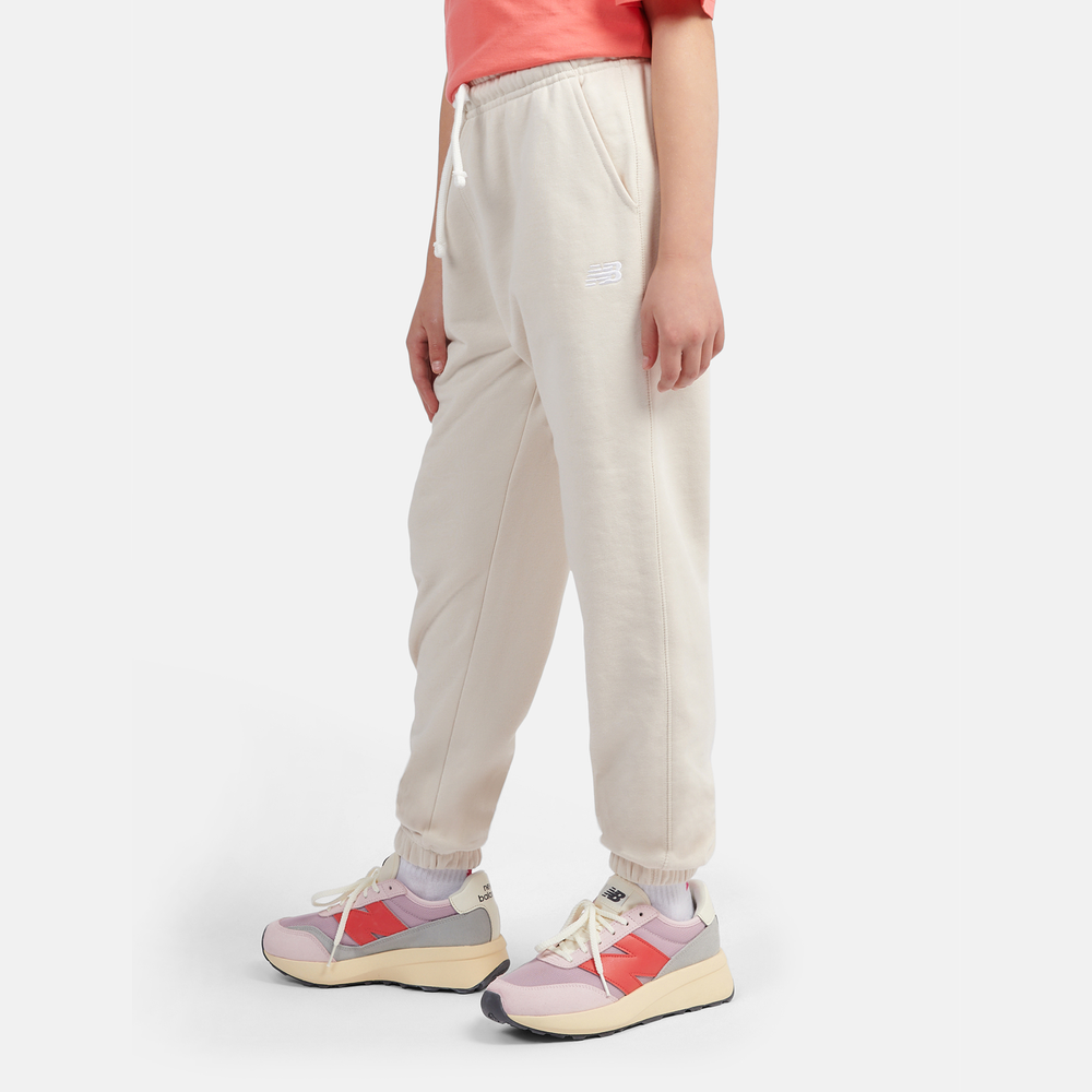 Dětské kalhoty New Balance LAKG0058LIN – béžové