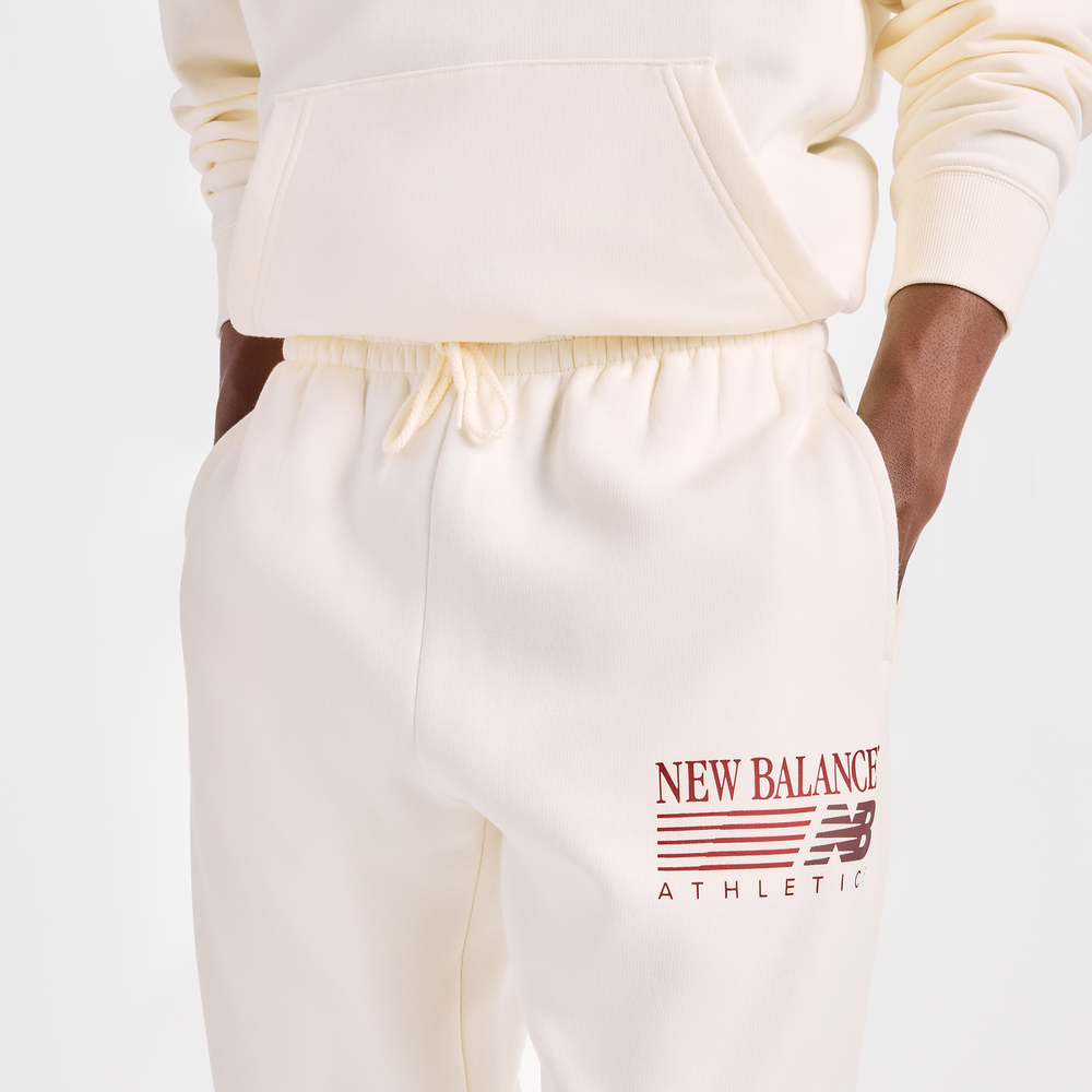 Pánské kalhoty New Balance Reimagined Graphic – béžové