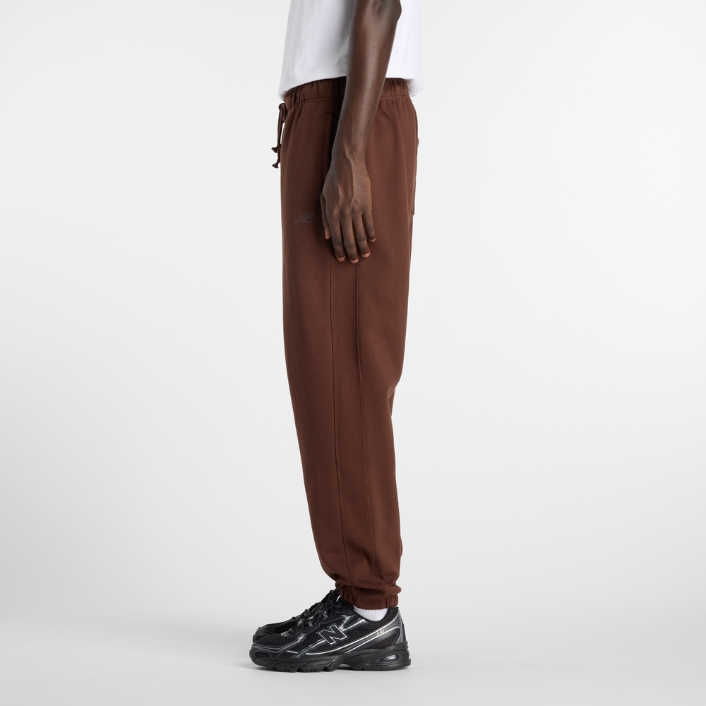 Pánské kalhoty New Balance MP41508ABJ – hnědý