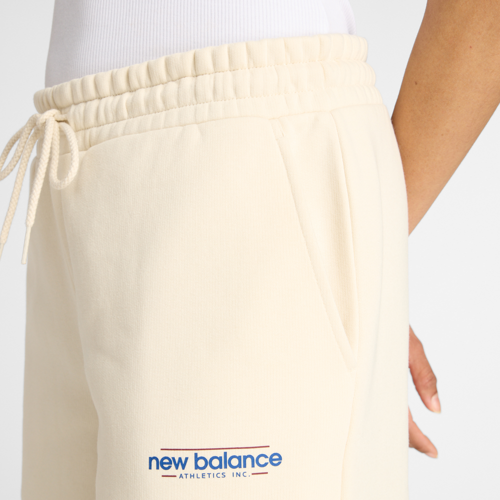 Dámské kalhoty New Balance WP53903LIN – béžové
