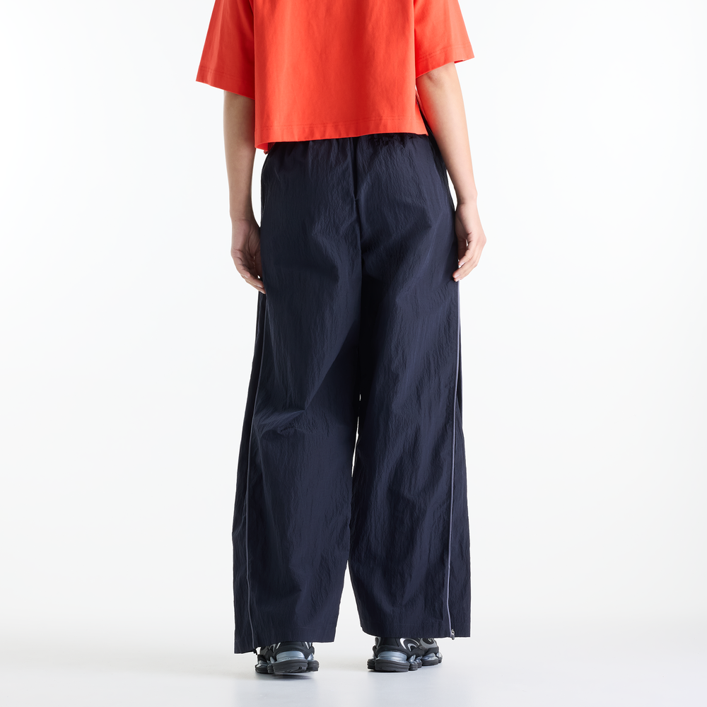 Dámské kalhoty New Balance Sport Legacy – tmavomodrá