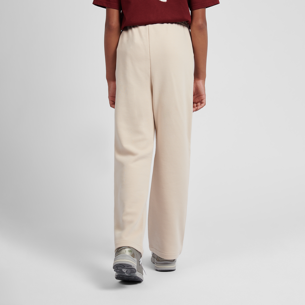 Dětské kalhoty New Balance LAKG0216BIS – béžové