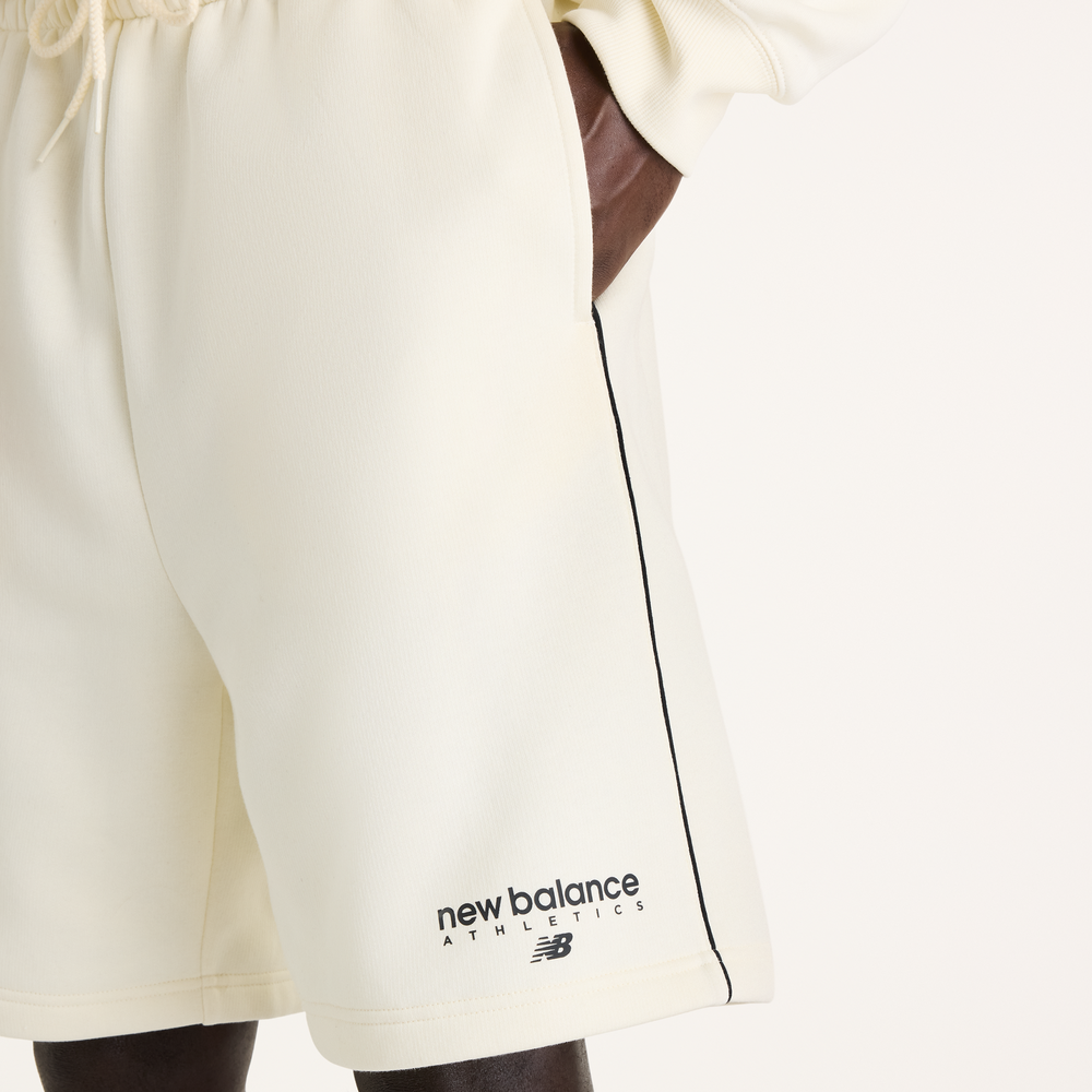 Pánské šortky New Balance Sport Linear Graphic – béžové