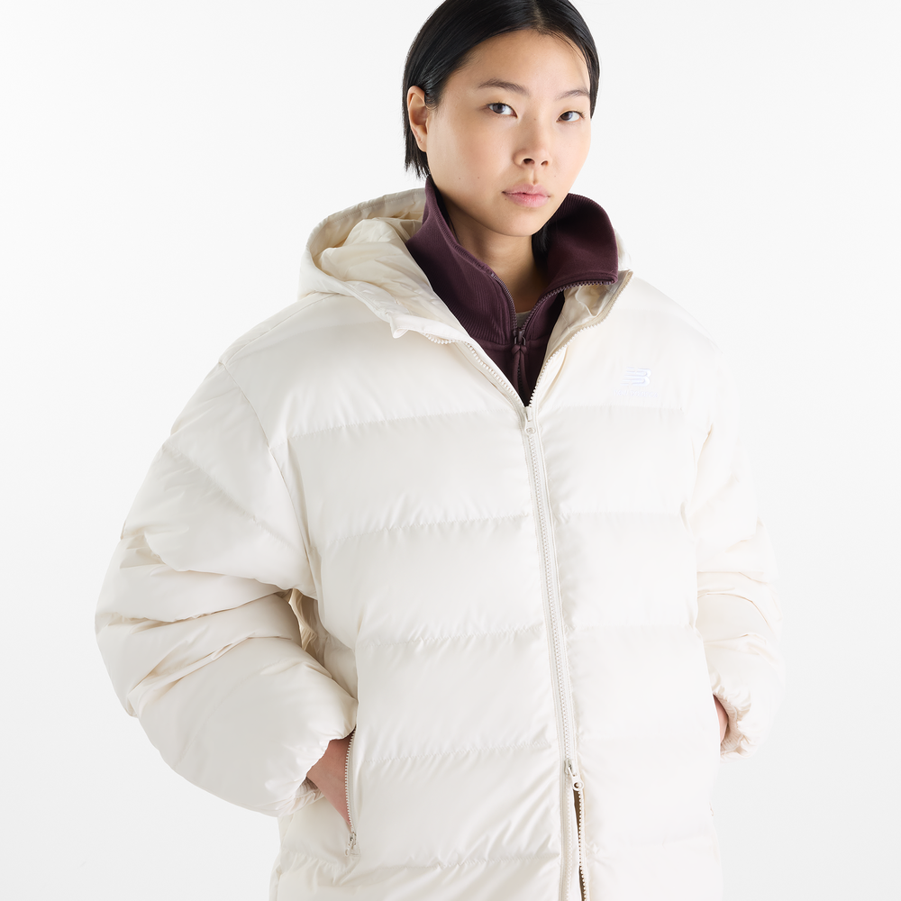 Dámská bunda New Balance Boston Long Puffer – béžové