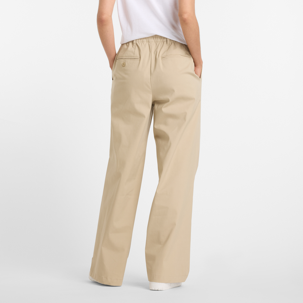 Dámské kalhoty New Balance WP51538SOT – béžové