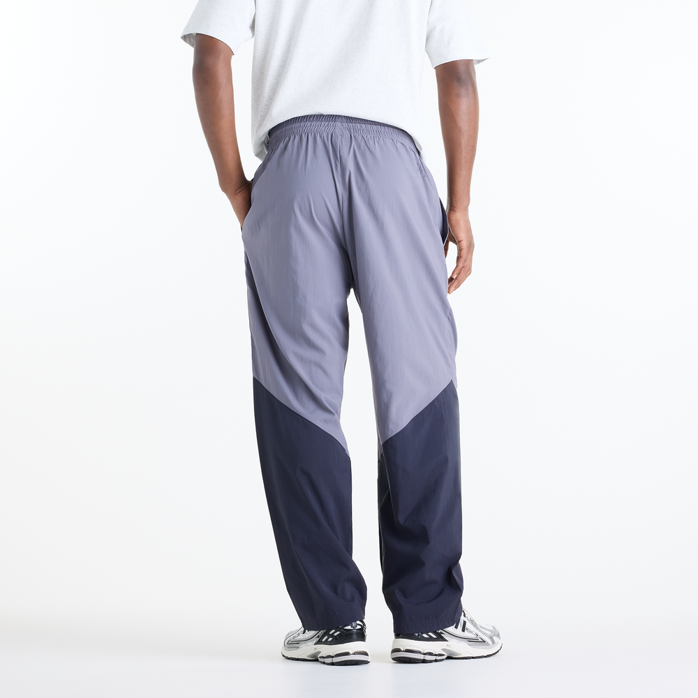 Pánské kalhoty New Balance Sport Legacy – fialové