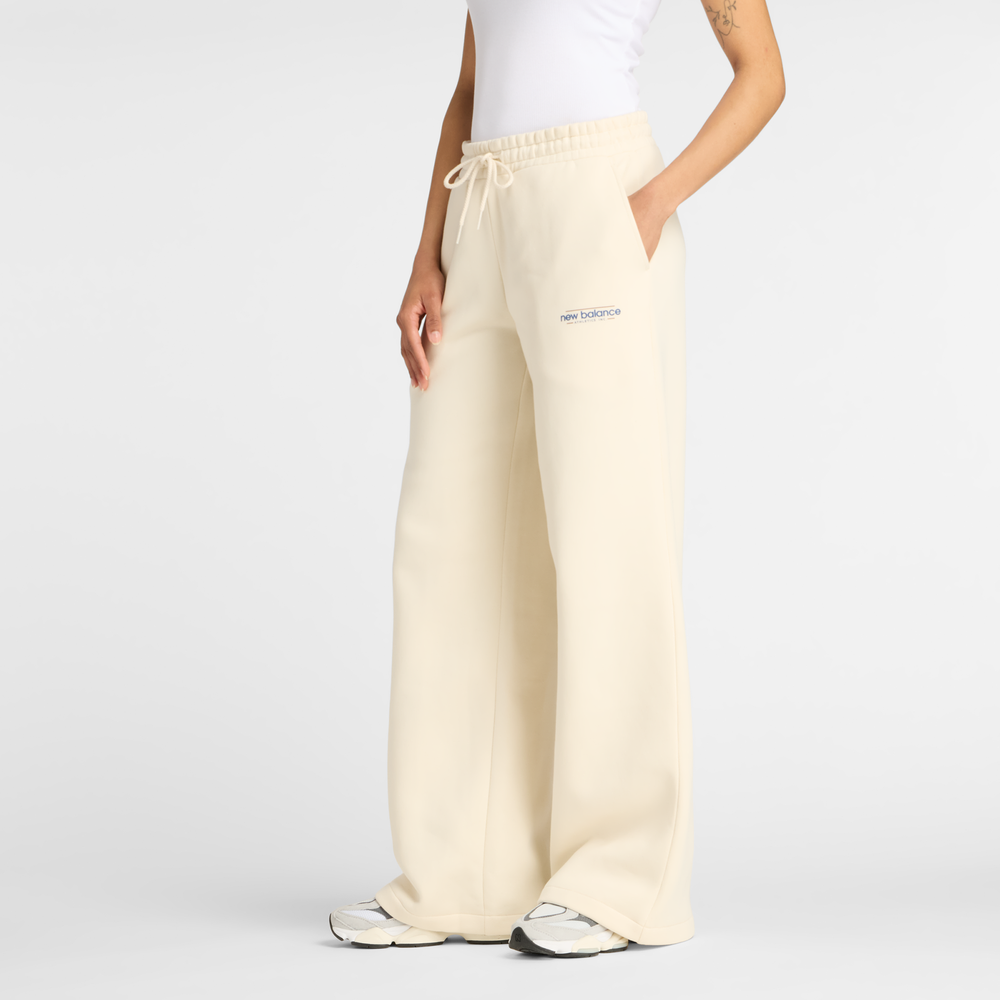 Dámské kalhoty New Balance WP53903LIN – béžové