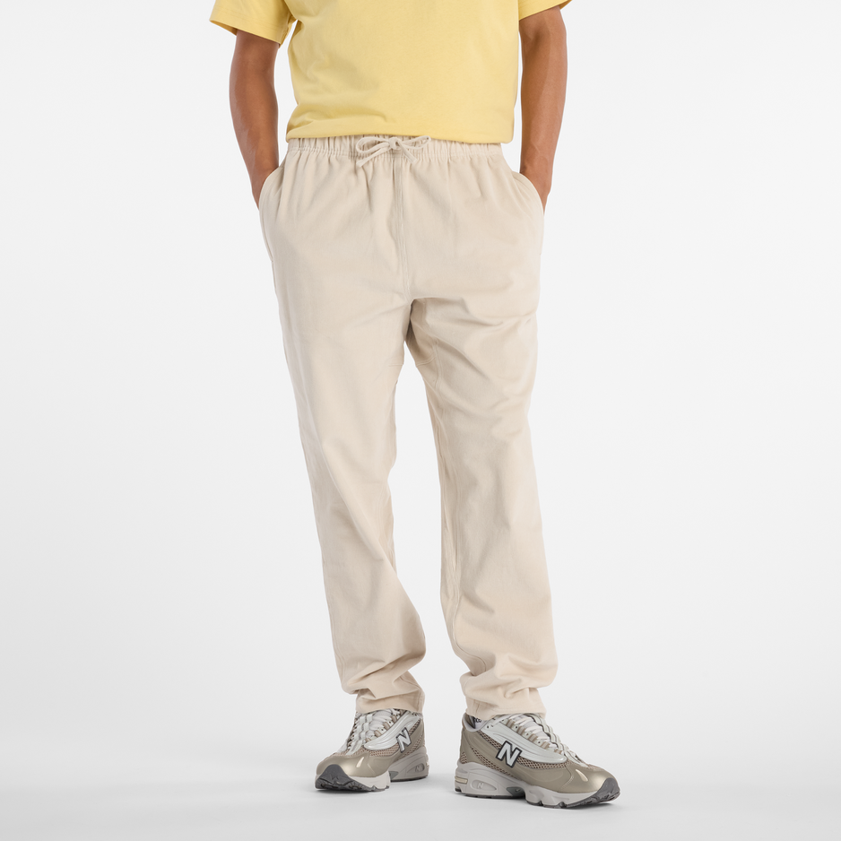 Pánské kalhoty New Balance MP53521TWF – béžové