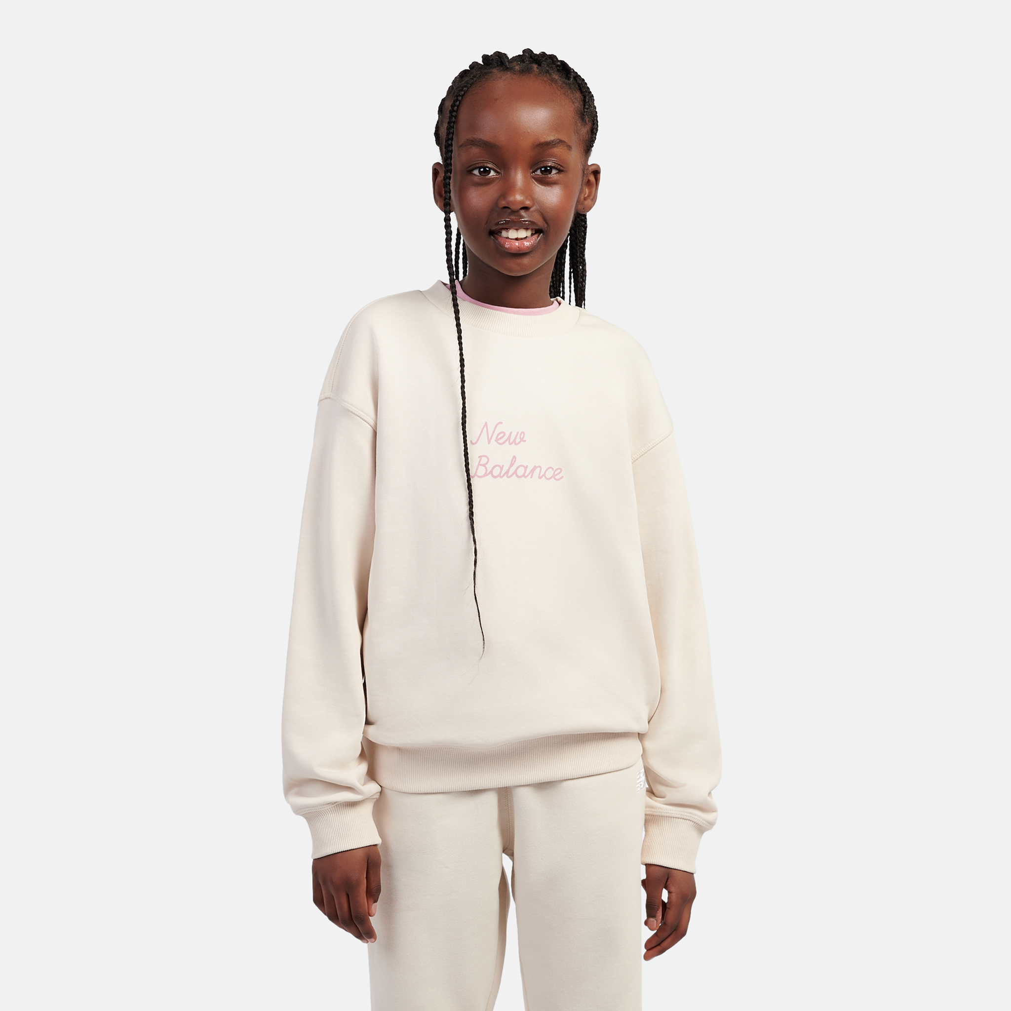 

Dětská mikina New Balance LAKG0203BIS – béžové