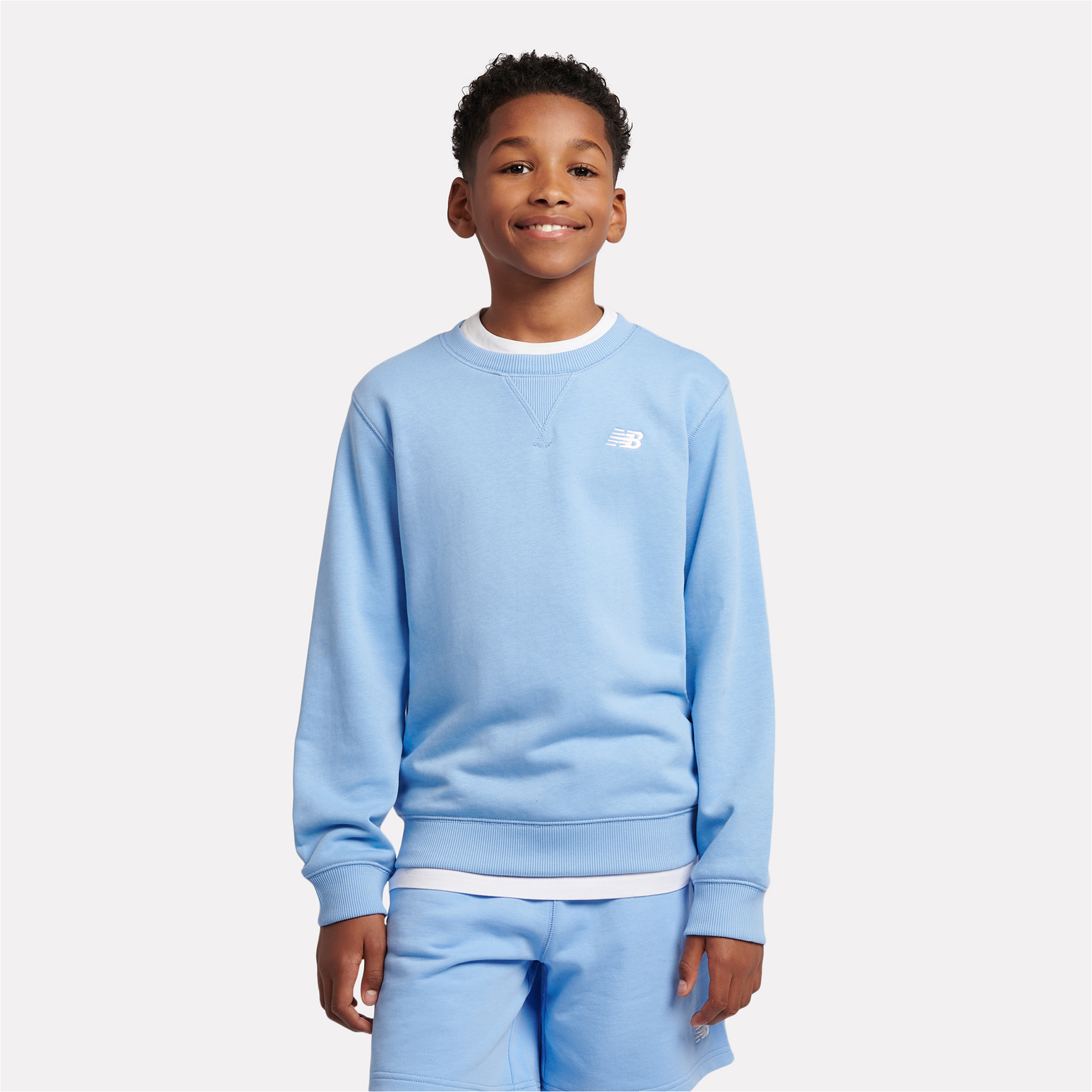 

Dětská mikina New Balance LAKB0055ELE – modré