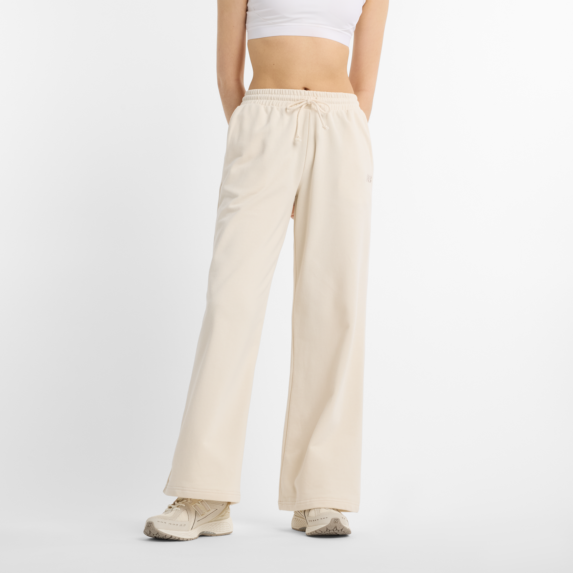 

Dámské kalhoty New Balance WP51503LIN – béžové