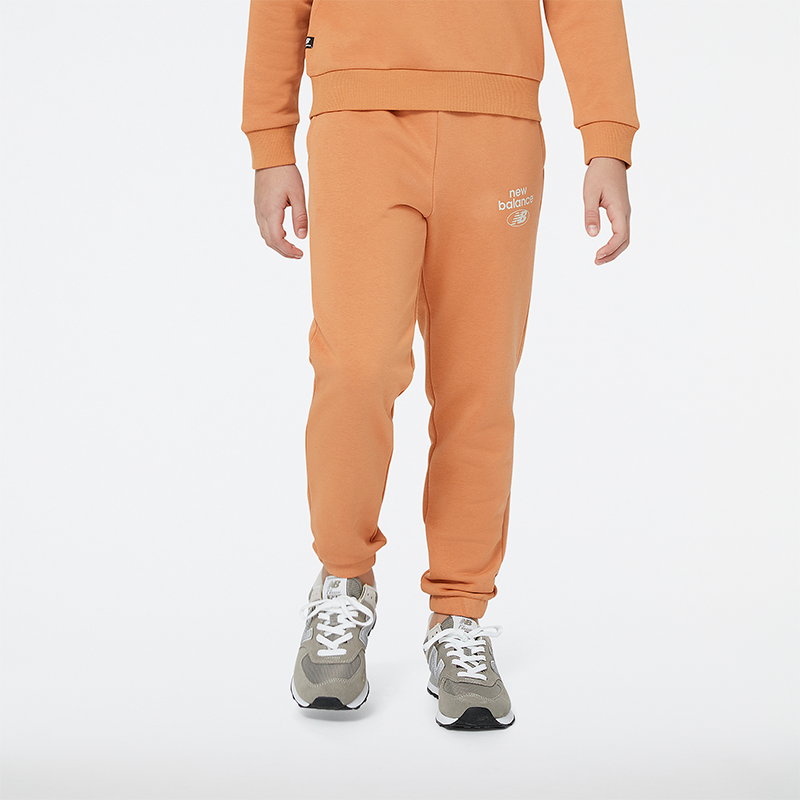 Levně Dětské kalhoty New Balance YP31508SEI – oranžová