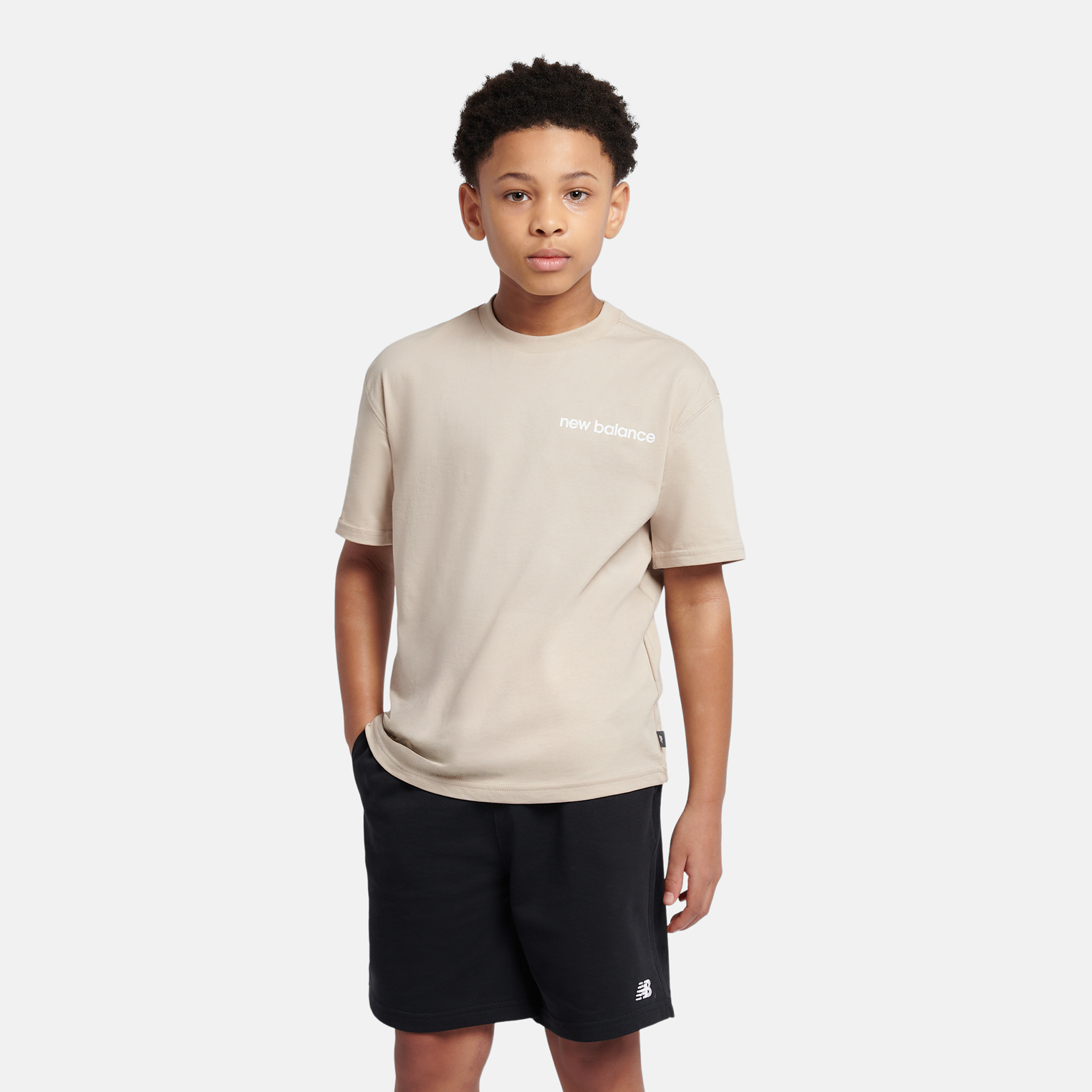 

Dětské tričko New Balance YT61A21ATWF – béžové