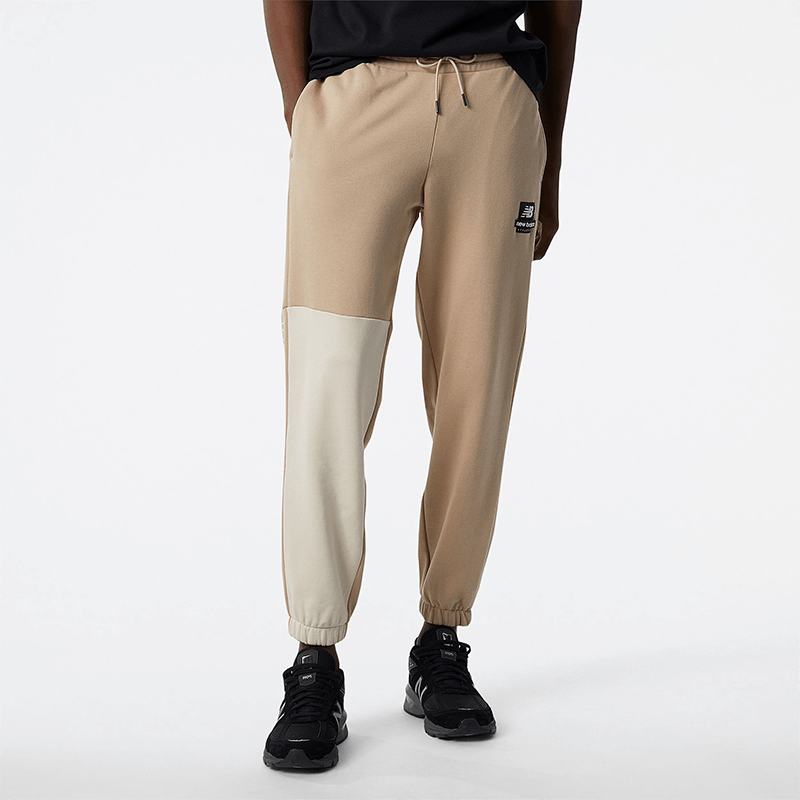 

Kalhoty New Balance MP21550MDY – béžové