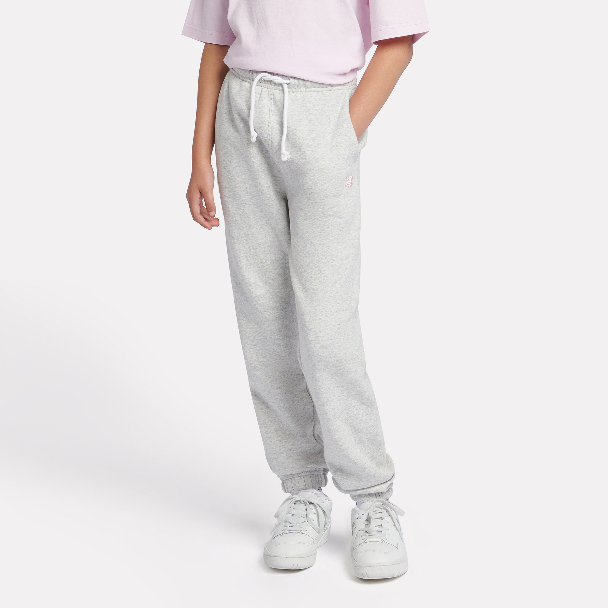 

Dětské kalhoty New Balance LAKG0058AHH – šedé