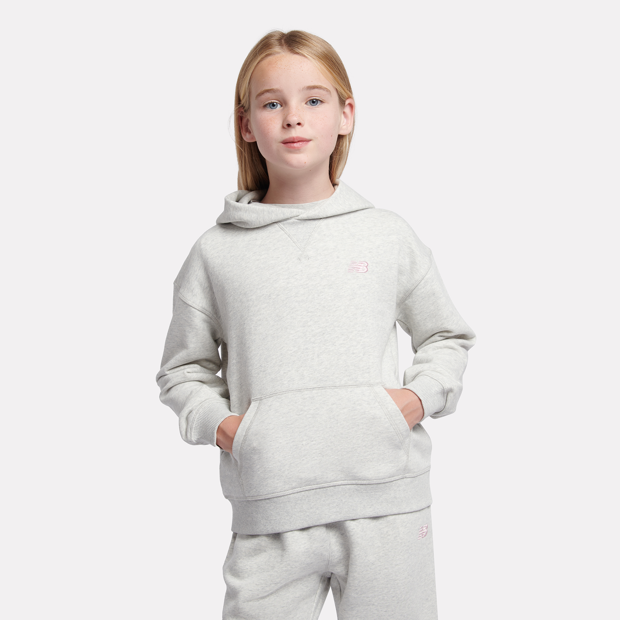 

Dětská mikina New Balance LAKG0056AHH – šedé