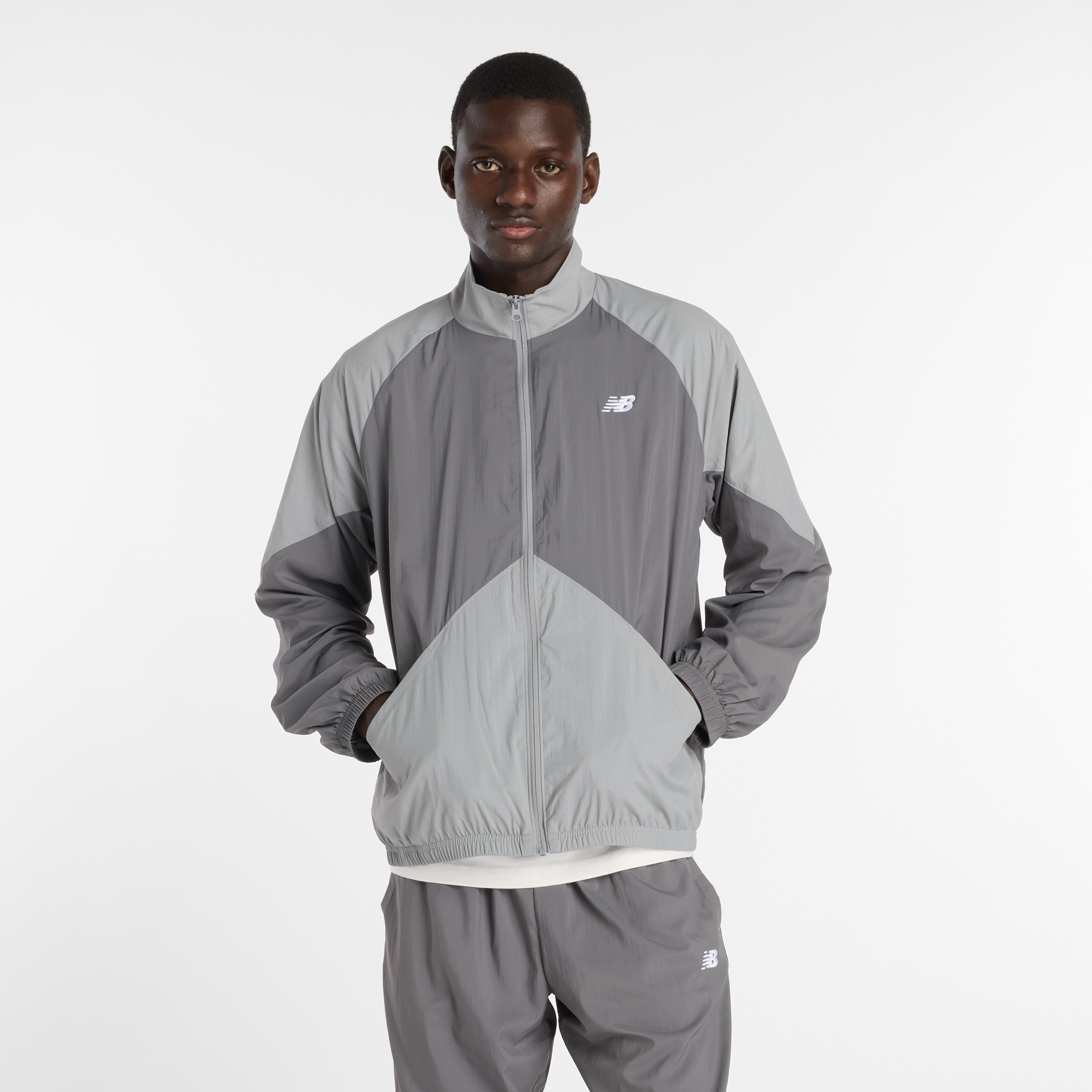 

Pánská bunda New Balance MJ61J73YCAS – šedé