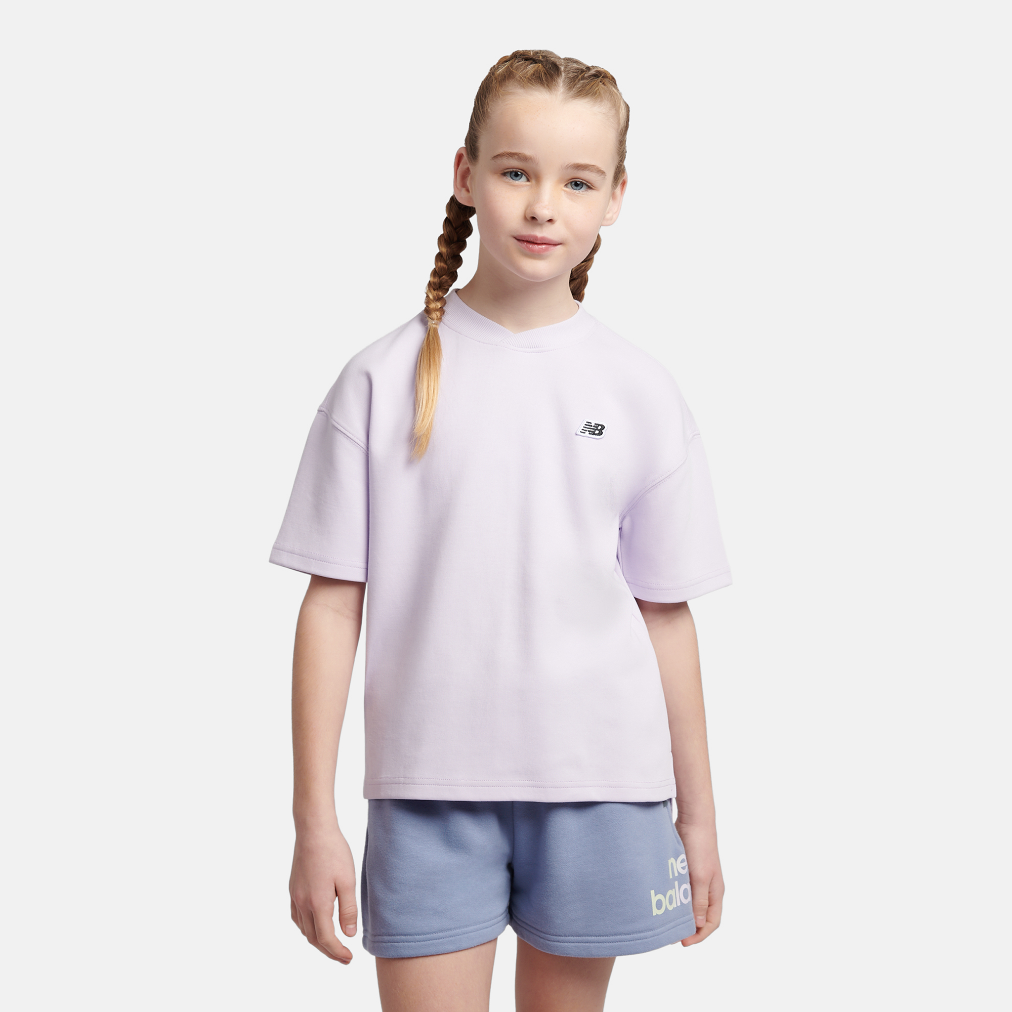 

Dětské tričko New Balance LAKG0135RIG – fialové