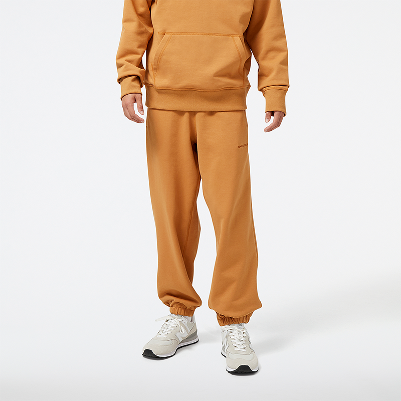 Levně Pánské kalhoty New Balance MP23551TOB – oranžová